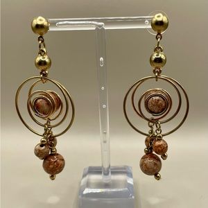 Gold and brown dangle earrings with brown beads and gold wire spiral circles